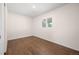 This bedroom features hardwood floors and a window that provides natural light at 7870 Magnolia St, Commerce City, CO 80022