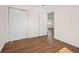 Spacious bedroom featuring hardwood floors and closet at 7870 Magnolia St, Commerce City, CO 80022