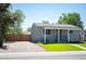 A quaint single-story home featuring a fenced yard and a comfortable outdoor seating area at 7870 Magnolia St, Commerce City, CO 80022