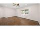 Bright living room featuring hardwood floors and a large window offering natural light at 7870 Magnolia St, Commerce City, CO 80022