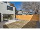 Home's backyard has a wood fence for privacy and a concrete patio at 372 S Humboldt St, Denver, CO 80209