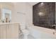 Bathroom with marble sink and black tile wall at 372 S Humboldt St, Denver, CO 80209