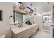 Bright bathroom featuring double vanity with modern light fixtures at 372 S Humboldt St, Denver, CO 80209