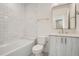 Chic bathroom highlighting a combined tub and shower with elegant finishes at 372 S Humboldt St, Denver, CO 80209