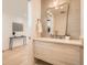 Bathroom features a modern vanity, unique mirror, and stylish tiling at 372 S Humboldt St, Denver, CO 80209