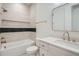 Bright bathroom with tub, shower, stylish vanity, and modern finishes at 372 S Humboldt St, Denver, CO 80209