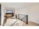 Open hallway features natural light, modern railings, and a cozy sitting area with a window view at 372 S Humboldt St, Denver, CO 80209