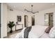 Bright main bedroom featuring modern lighting, minimalist decor, and ensuite bathroom access at 372 S Humboldt St, Denver, CO 80209