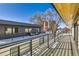 Spacious rooftop deck with sleek railings, snow, and views of the surrounding cityscape at 372 S Humboldt St, Denver, CO 80209