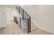 Modern staircase featuring sleek black railings and light wood treads at 372 S Humboldt St, Denver, CO 80209