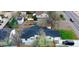 Aerial view of house, black roof, and surrounding neighborhood at 1450 Syracuse St, Denver, CO 80220