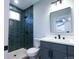 This bathroom has a shower stall with subway tile and contemporary fixtures at 1450 Syracuse St, Denver, CO 80220