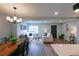Bright and airy living room with a modern dining table, a view of the entry door, and comfortable seating at 1450 Syracuse St, Denver, CO 80220