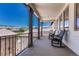 Inviting outdoor balcony featuring two comfortable rocking chairs with views of the neighborhood at 9343 Vista Hill Ln, Lone Tree, CO 80124