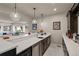 Spacious wet bar with a sink, stainless steel appliances, and open to the living room at 9343 Vista Hill Ln, Lone Tree, CO 80124