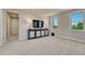 Second-floor bonus room featuring plush carpeting, two windows and custom cabinet at 9343 Vista Hill Ln, Lone Tree, CO 80124