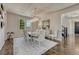 Elegant dining room featuring a large window, statement chandelier, and comfortable seating for six at 9343 Vista Hill Ln, Lone Tree, CO 80124