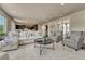 A living room featuring large windows, a fireplace, and open-concept design seamlessly blending living and dining spaces at 9343 Vista Hill Ln, Lone Tree, CO 80124