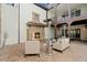 Inviting outdoor patio with stone fireplace and comfortable seating for relaxation at 9343 Vista Hill Ln, Lone Tree, CO 80124