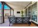Stylish outdoor living space with comfortable seating, a mounted television and privacy at 9343 Vista Hill Ln, Lone Tree, CO 80124