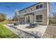 Large backyard with patio, outdoor seating, and well-manicured landscaping at 10487 Panther Trce, Lone Tree, CO 80124