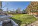 A sprawling green lawn defines this backyard, perfect for recreation and relaxation at 10487 Panther Trce, Lone Tree, CO 80124