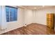 A finished basement with wood floors offers space for recreation and storage at 10487 Panther Trce, Lone Tree, CO 80124