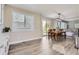 Bright dining area with a sliding door and wood floors, seamlessly connecting indoor and outdoor spaces at 10487 Panther Trce, Lone Tree, CO 80124