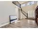 Elegant foyer with a staircase, high ceilings, and a double door entrance, creating a grand entry at 10487 Panther Trce, Lone Tree, CO 80124