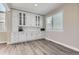 Stylish living room featuring custom cabinetry and plenty of natural light, offering a cozy atmosphere at 10487 Panther Trce, Lone Tree, CO 80124