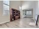 Bright living room featuring a large bookcase and an open layout, perfect for entertaining and relaxation at 10487 Panther Trce, Lone Tree, CO 80124