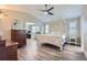 Spacious bedroom with vaulted ceilings, a four-poster bed and wood-look floors at 10487 Panther Trce, Lone Tree, CO 80124