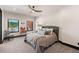 Comfortable bedroom featuring a ceiling fan, two windows and neutral decor at 367 Sandy Hollow Trl, Franktown, CO 80116
