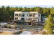 Modern house with multiple balconies, outdoor seating and hot tub at 367 Sandy Hollow Trl, Franktown, CO 80116