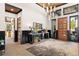 This foyer has high ceilings, wood beam accents, a decorative rug, and unique decor at 367 Sandy Hollow Trl, Franktown, CO 80116