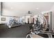 Spacious home gym featuring modern exercise equipment and ceiling fans for ventilation at 367 Sandy Hollow Trl, Franktown, CO 80116