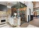 Modern kitchen features a wine cellar, stainless steel appliances, and premium countertops at 367 Sandy Hollow Trl, Franktown, CO 80116