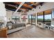 This main bedroom has a fireplace, wood floors, multiple windows, and a sitting area at 367 Sandy Hollow Trl, Franktown, CO 80116