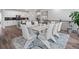 Elegant dining room features modern furnishings, stylish decor, and seamless access to the kitchen at 15788 Xanthia Way, Thornton, CO 80602