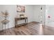 Inviting foyer with stylish wood floors, decorative accents, and a bright, welcoming atmosphere at 15788 Xanthia Way, Thornton, CO 80602