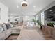 Spacious living room with wood flooring and lots of natural light creates an inviting atmosphere for relaxation at 15788 Xanthia Way, Thornton, CO 80602