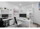 Well-lit home office with modern furniture, built-in shelving, and ample workspace at 15788 Xanthia Way, Thornton, CO 80602