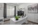 Bright home office featuring modern desk, large window, and contemporary decor at 15788 Xanthia Way, Thornton, CO 80602