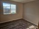 This bright bedroom offers ample natural light and wood-look floors at 2746 E 132Nd Pl, Thornton, CO 80241