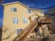 View of the home's exterior showing upper deck access and natural light at 2746 E 132Nd Pl, Thornton, CO 80241