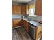 Modern kitchen with wood cabinets, granite counters, stainless steel appliances, and stylish backsplash at 2746 E 132Nd Pl, Thornton, CO 80241