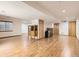 Spacious basement area with wood-look floors and recessed lighting, perfect for recreation at 7659 Lebrun Ct, Lone Tree, CO 80124