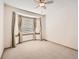 Bright bedroom with large bay window and neutral carpet at 7659 Lebrun Ct, Lone Tree, CO 80124