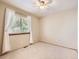 Clean and airy bedroom with plush neutral carpet at 7659 Lebrun Ct, Lone Tree, CO 80124