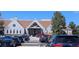 Large clubhouse with eye-catching architecture and ample parking for residents and their guests at 7659 Lebrun Ct, Lone Tree, CO 80124